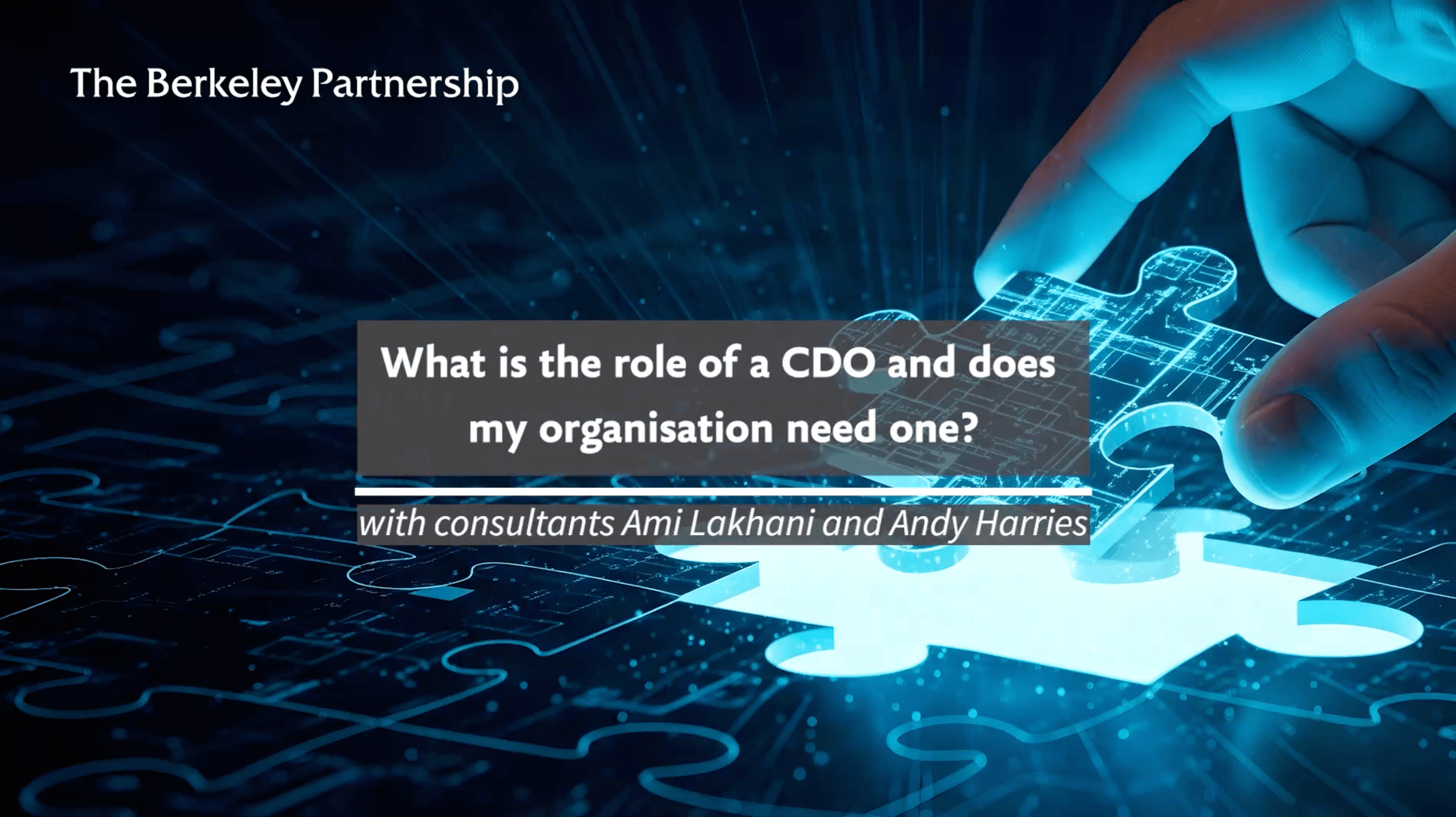A hand is completing a jigsaw of a digital blueprint with the final missing piece. Text overlaid on top of the image says: What is the role of a CDO and does my organisation need one? With consultants